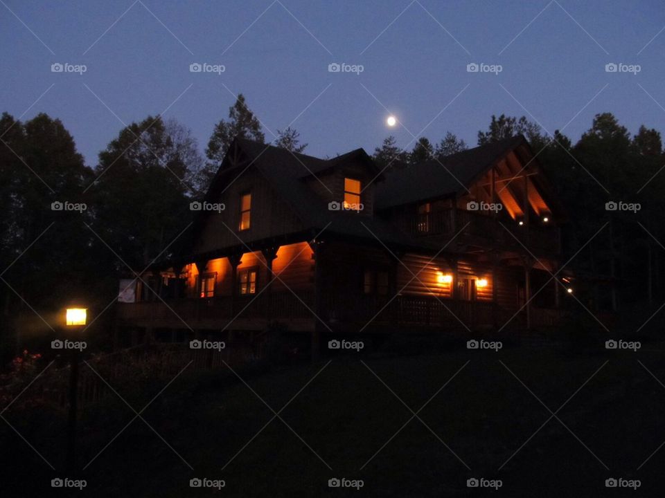 Log cabin at night