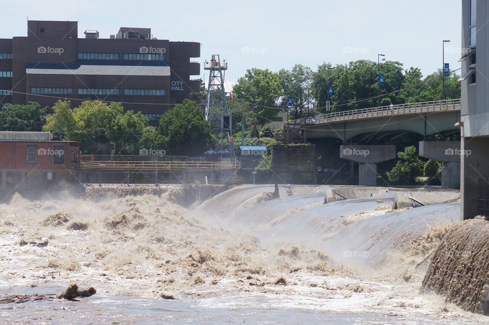 Flooding. Flossing River surges over a dam