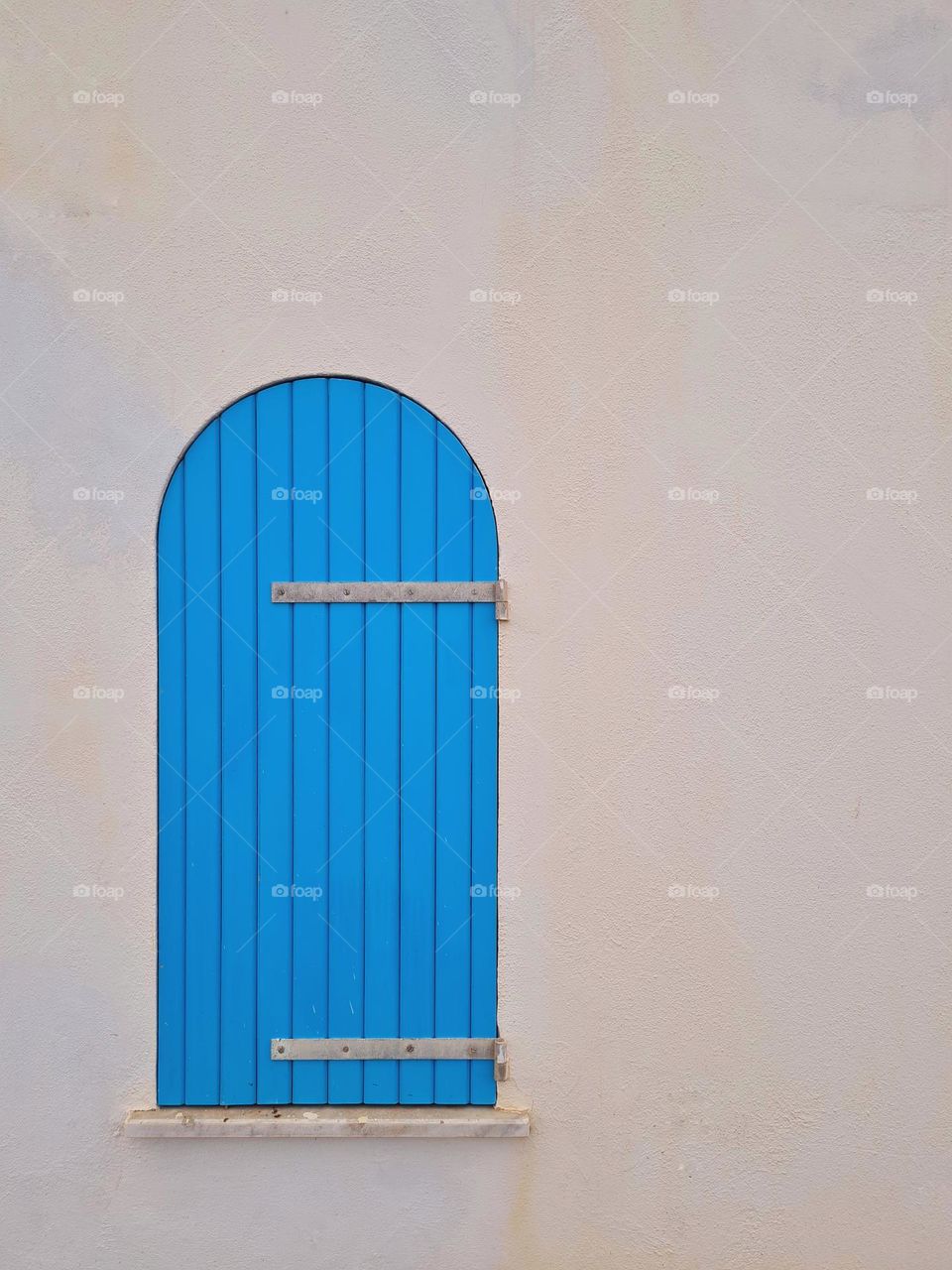 closed turquoise wooden window