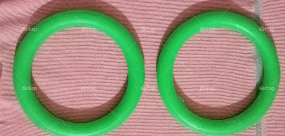 This plastic green colour rings, have geometry circle shape. Children's like play with this rings. This rings make children's happy and healthy.