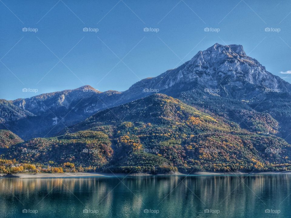 Scenic view of snowy mountain against clear sky