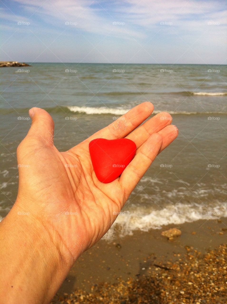 Red stone heart in my hand