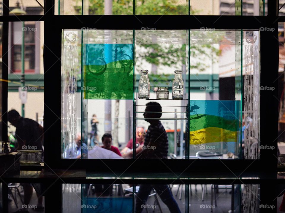 People silhouette through the artist window