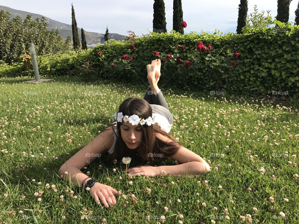 Teenage girl lying on grass