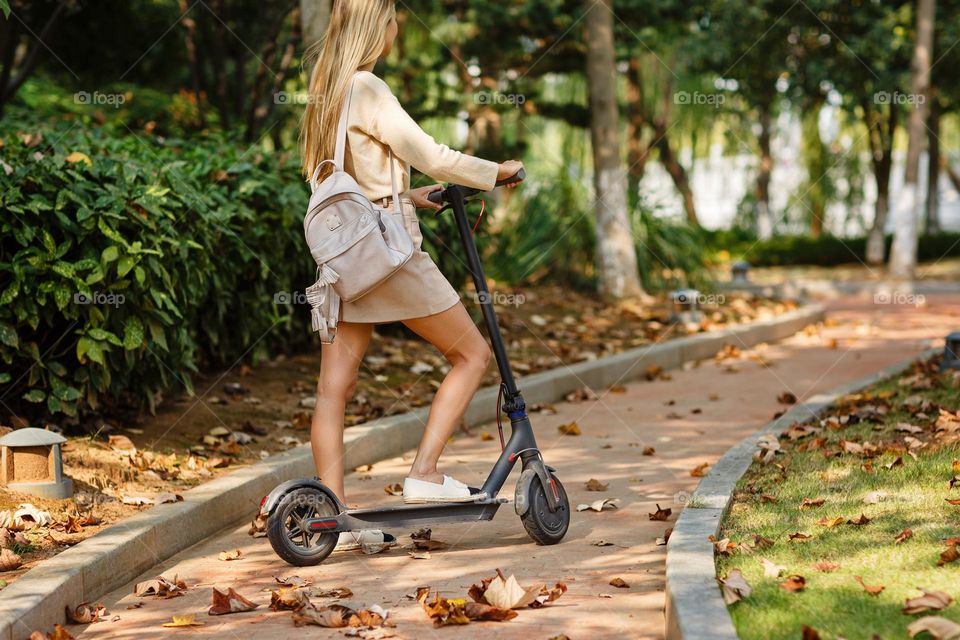 Woman using electric scooter