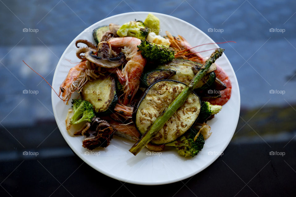 Plate of vegetables and seafood