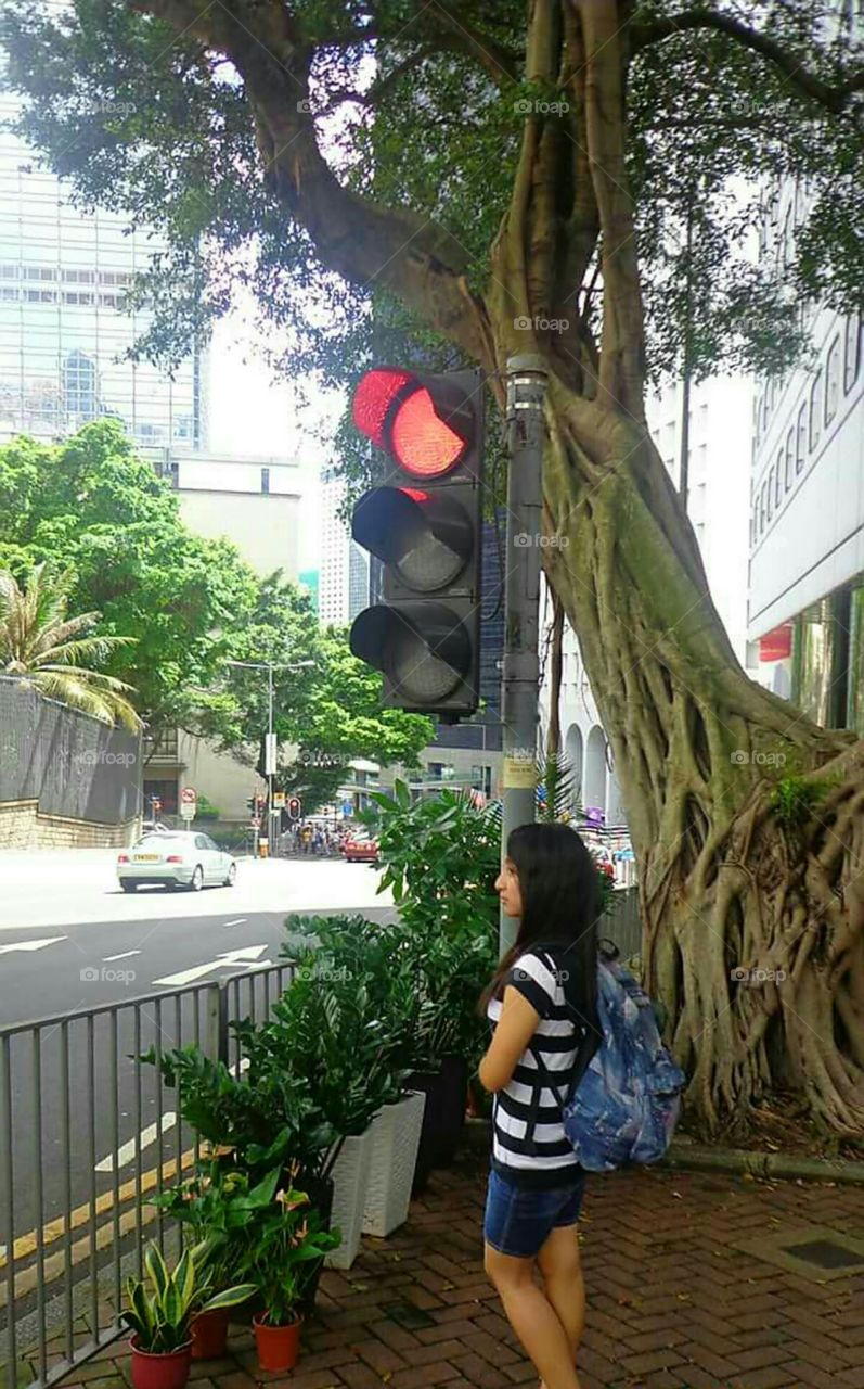 What's wrong with this picture?

Girl at the Stoplight.

Hongkong.
