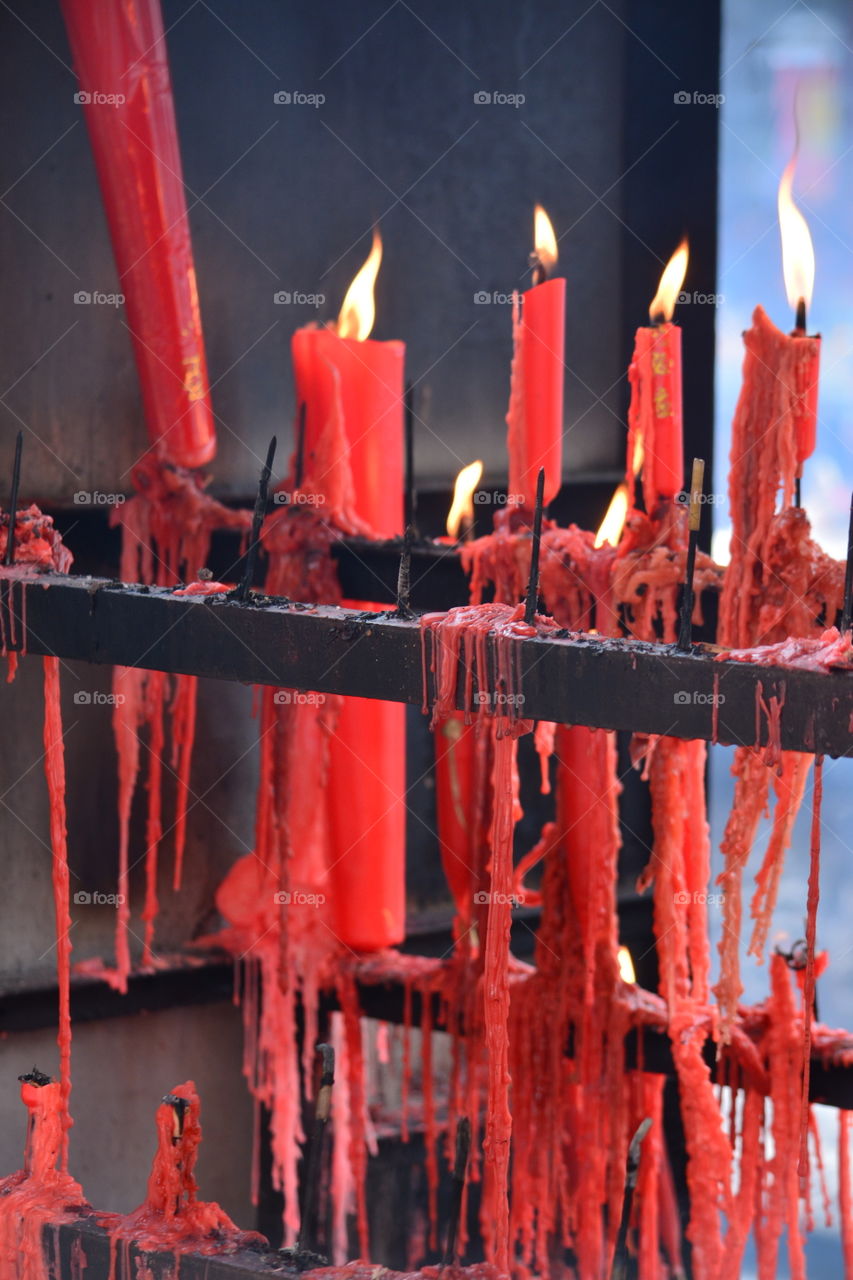 Glowing red candles - flowing wax, flames ... very cool