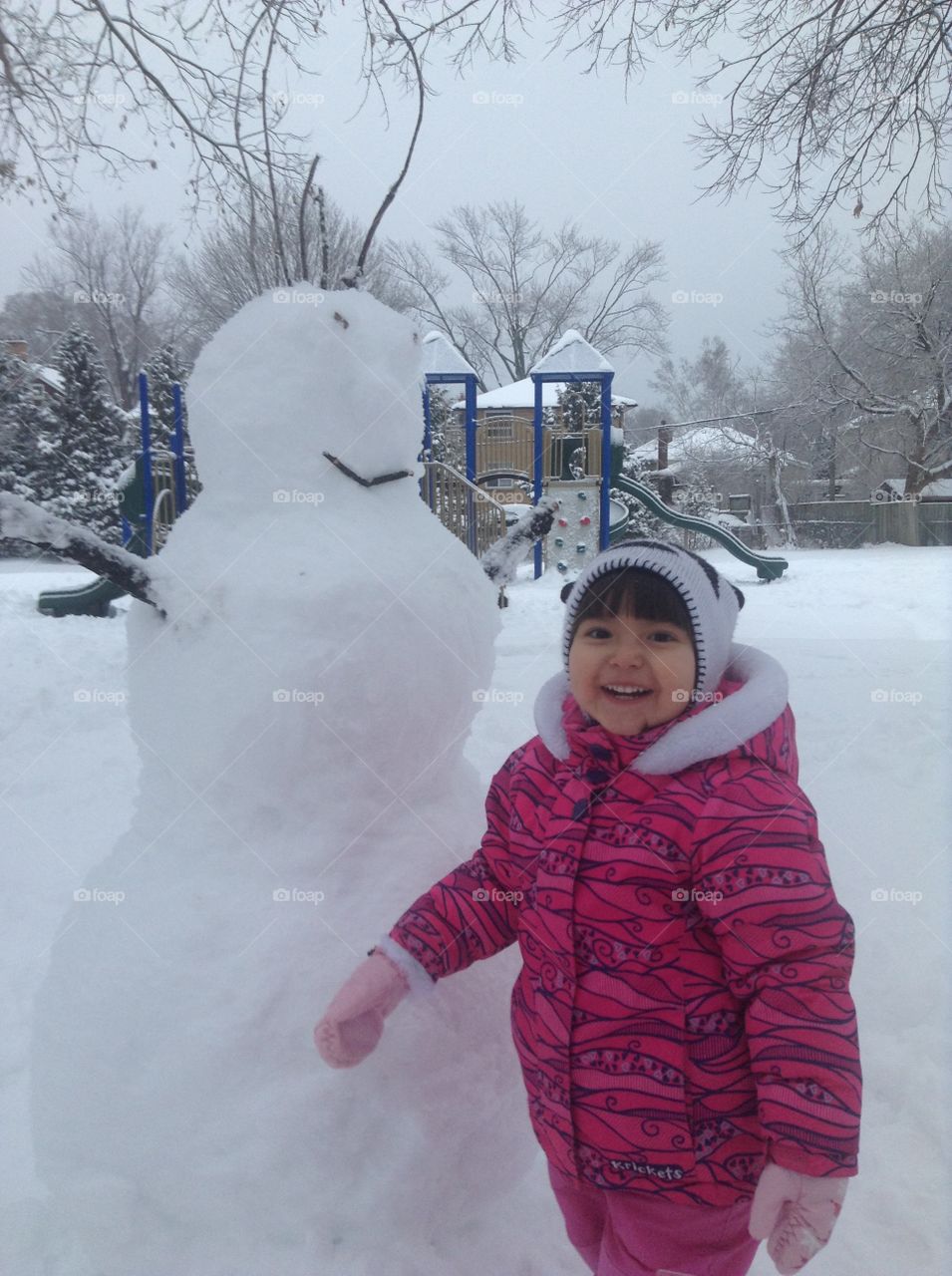 Smiling laughing girl in warm jacket