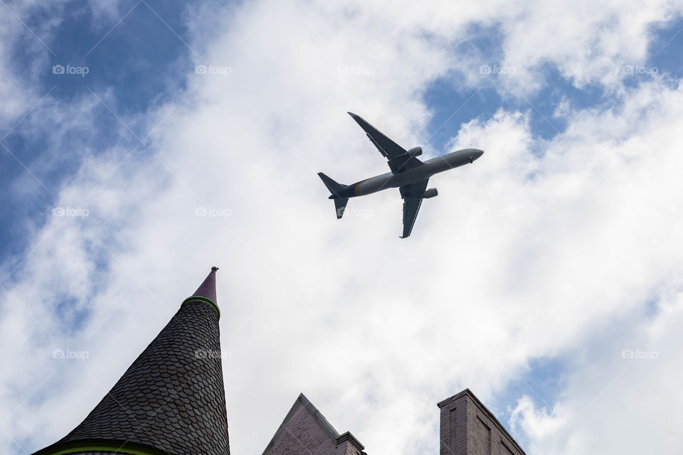 Airplane over houses