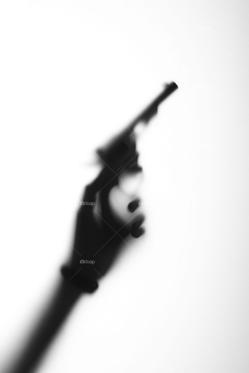 hand with a gun - shadow