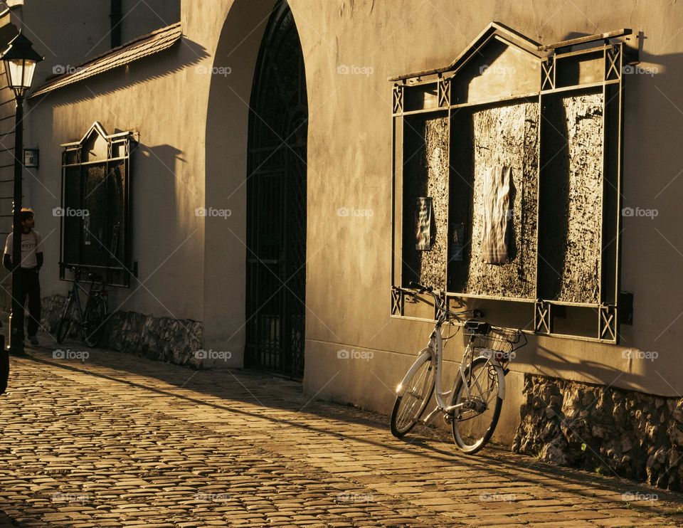 street of the old town in Krakow in the rays of the sun