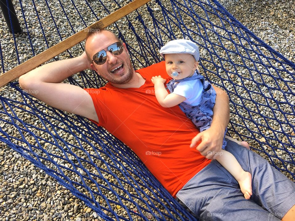 Man with his son in hammock