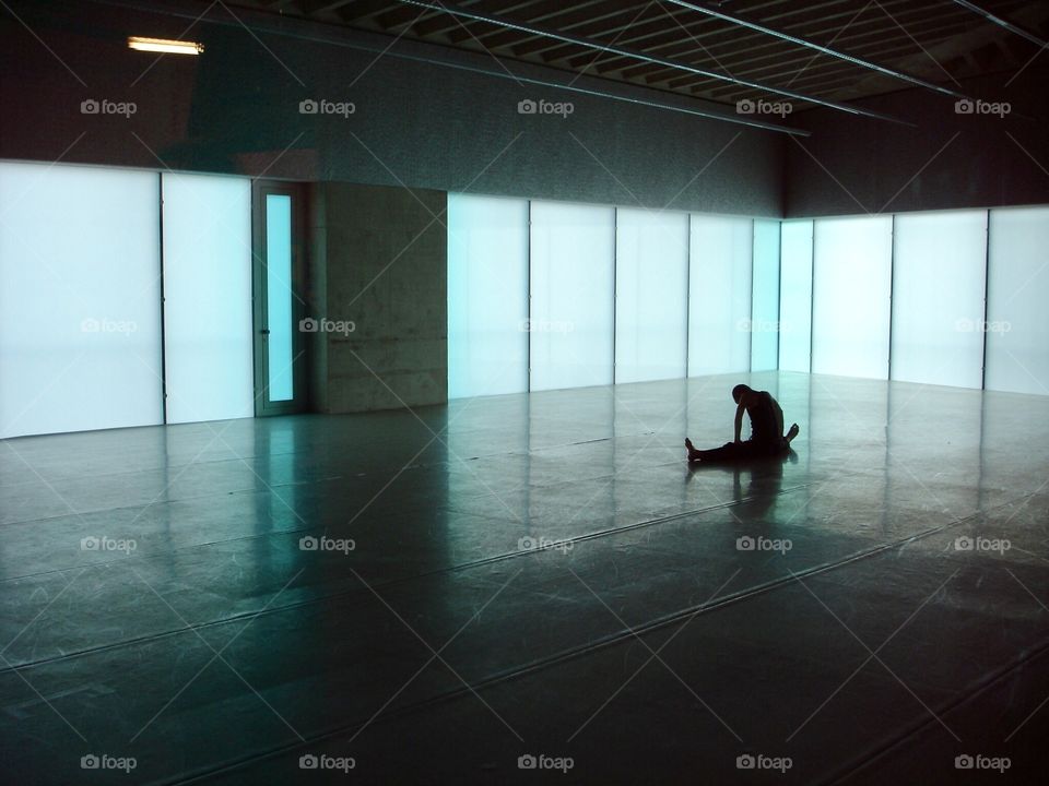 Stretching dancer alone in practice