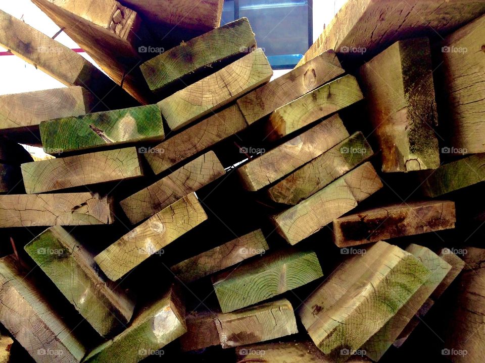Lumber. Roughly stacked lumber