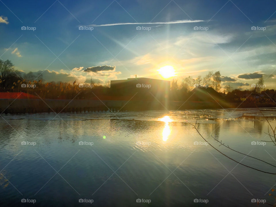 Sunset over frozen water