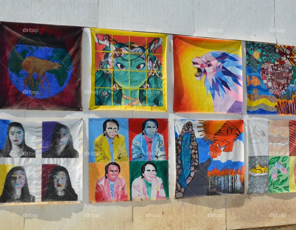 Outdoor wall covered in colorful art