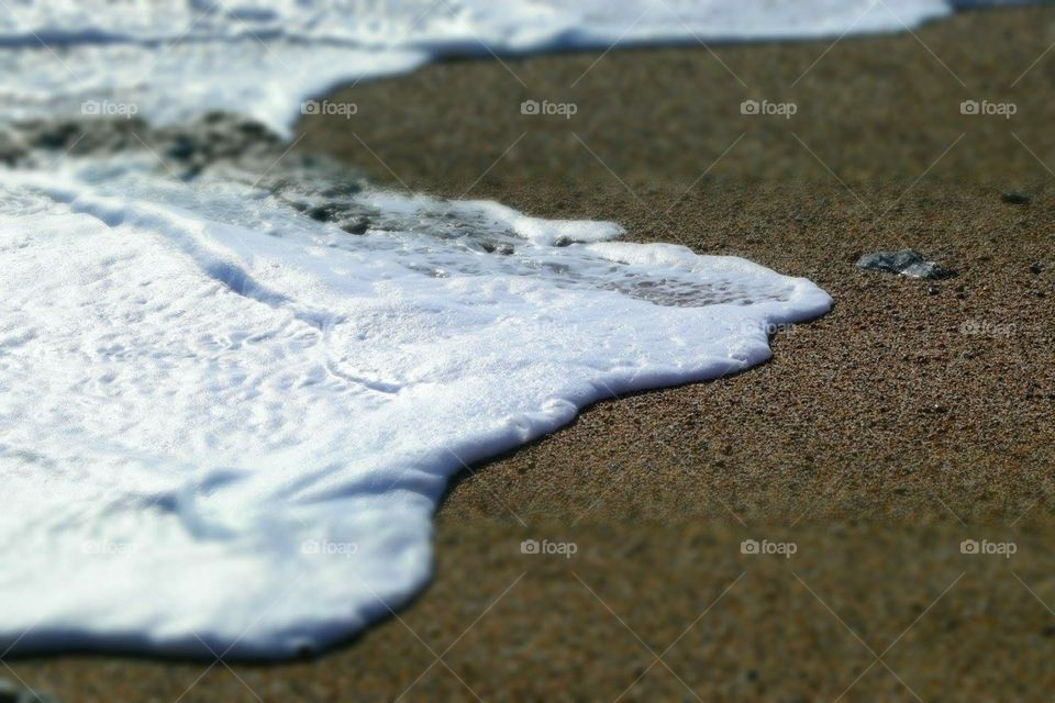 Foamy surf on the beach