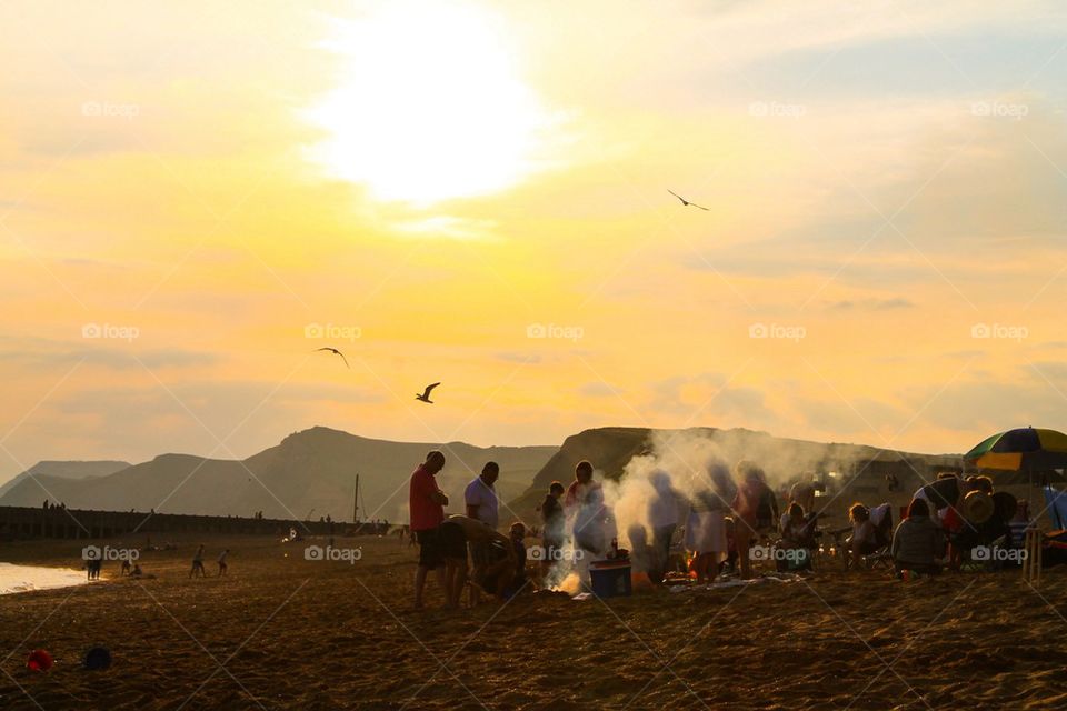 BBQ on the beach at sunset