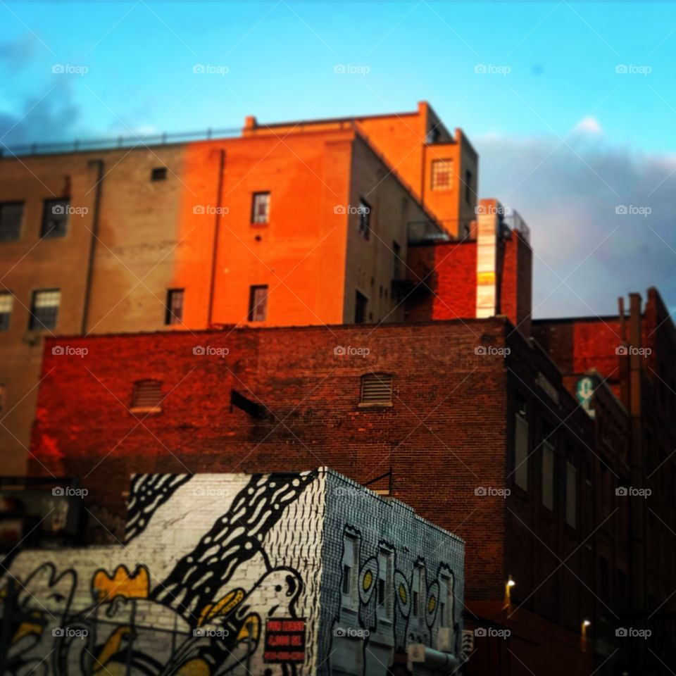 Buildings being hit by the sun at dusk in Detroit’s Eastern Market 