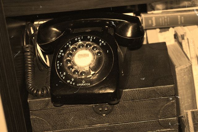 Old black rotary telephone. Old black rotary telephone