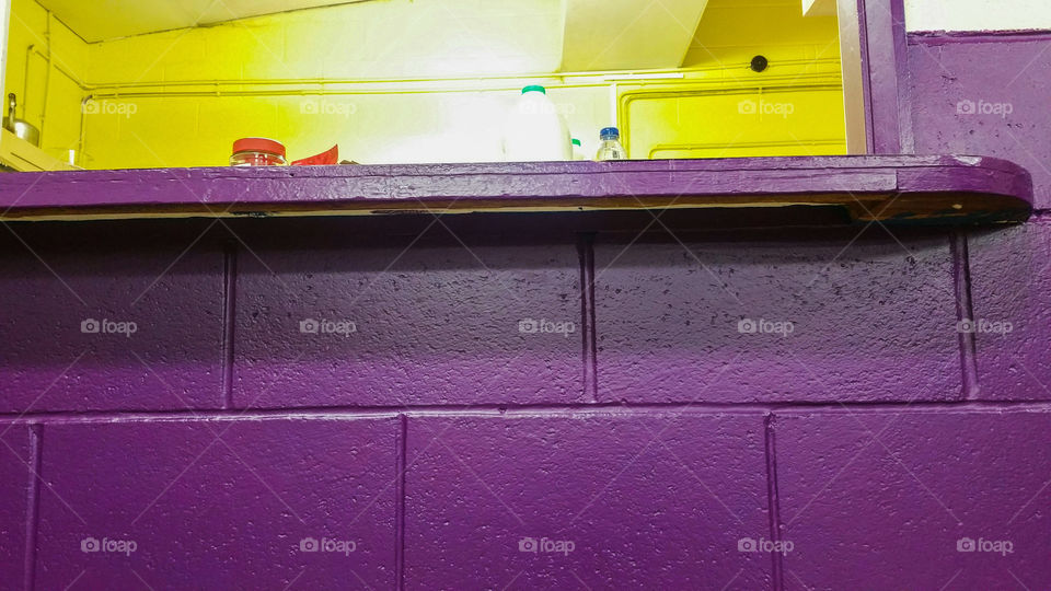 In a purple and yellow  room