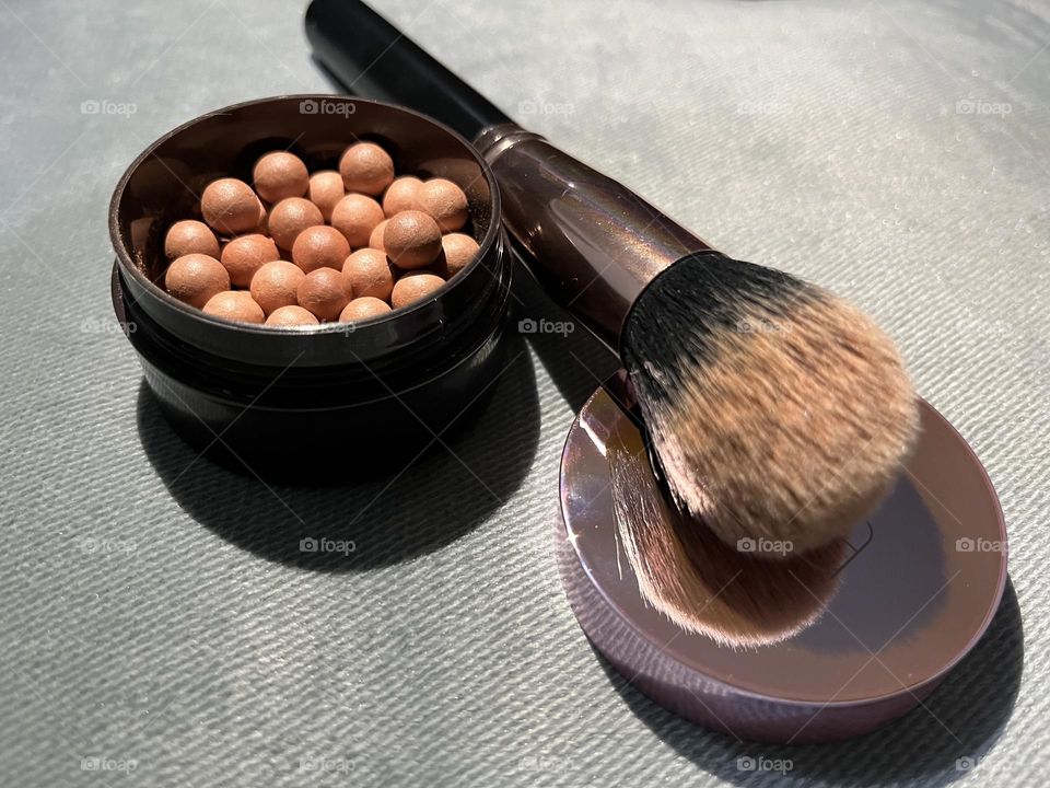 Blush face and contouring makeup and a brush 