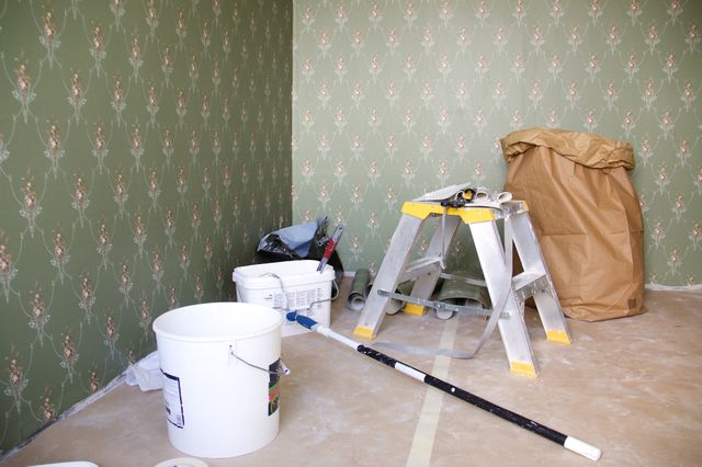 Put the wallpaper on the wall in a room