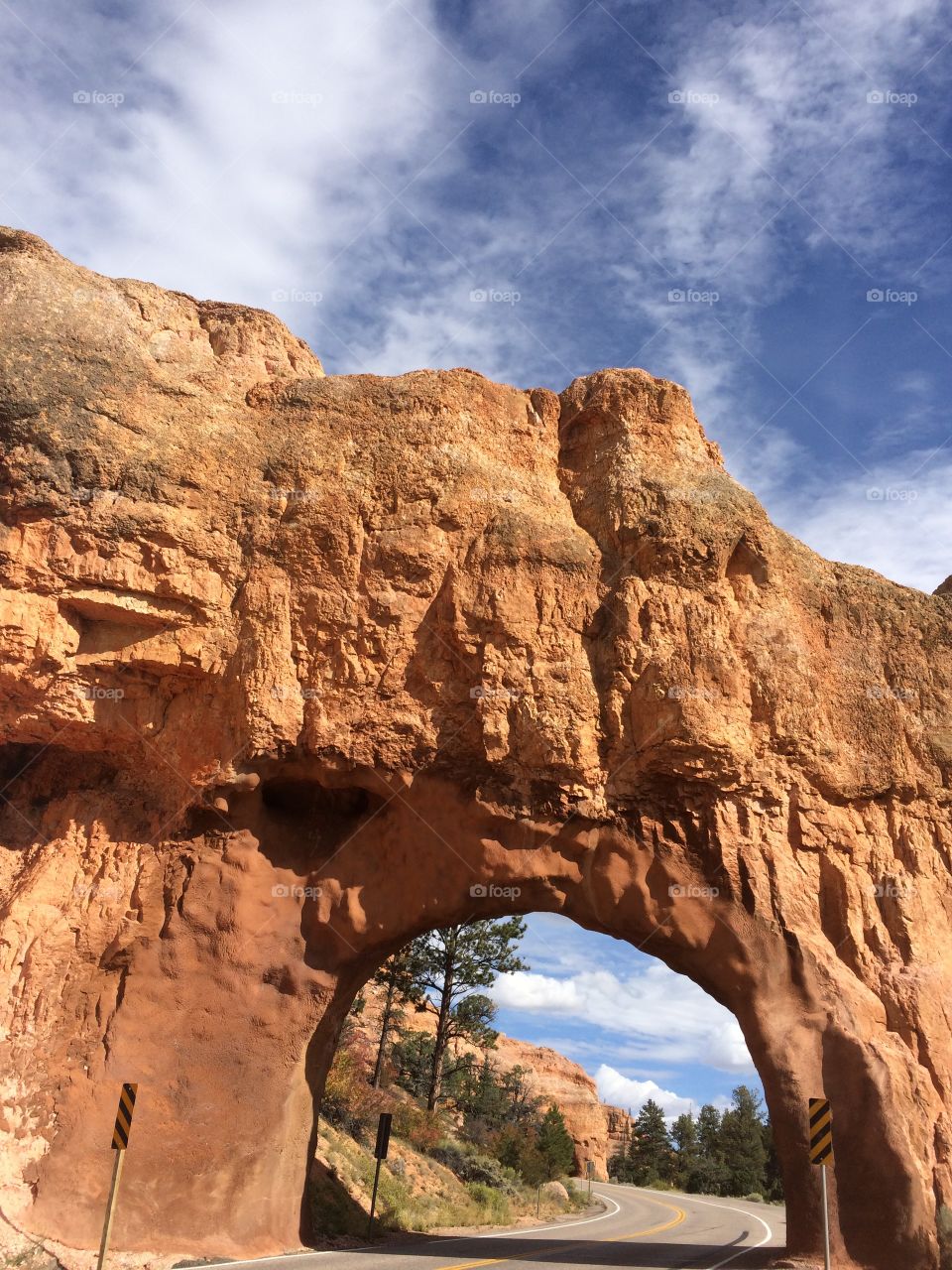 Drive through arch along the highway in Utah