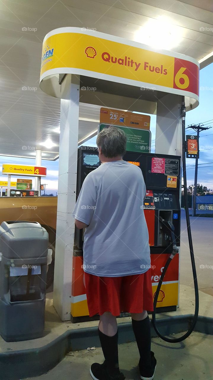 getting gas at the pump