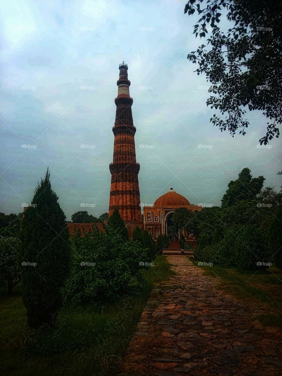 That tall brick structure with the light tower at the top looks so impressive! It's like a beacon shining bright. 🌟✨