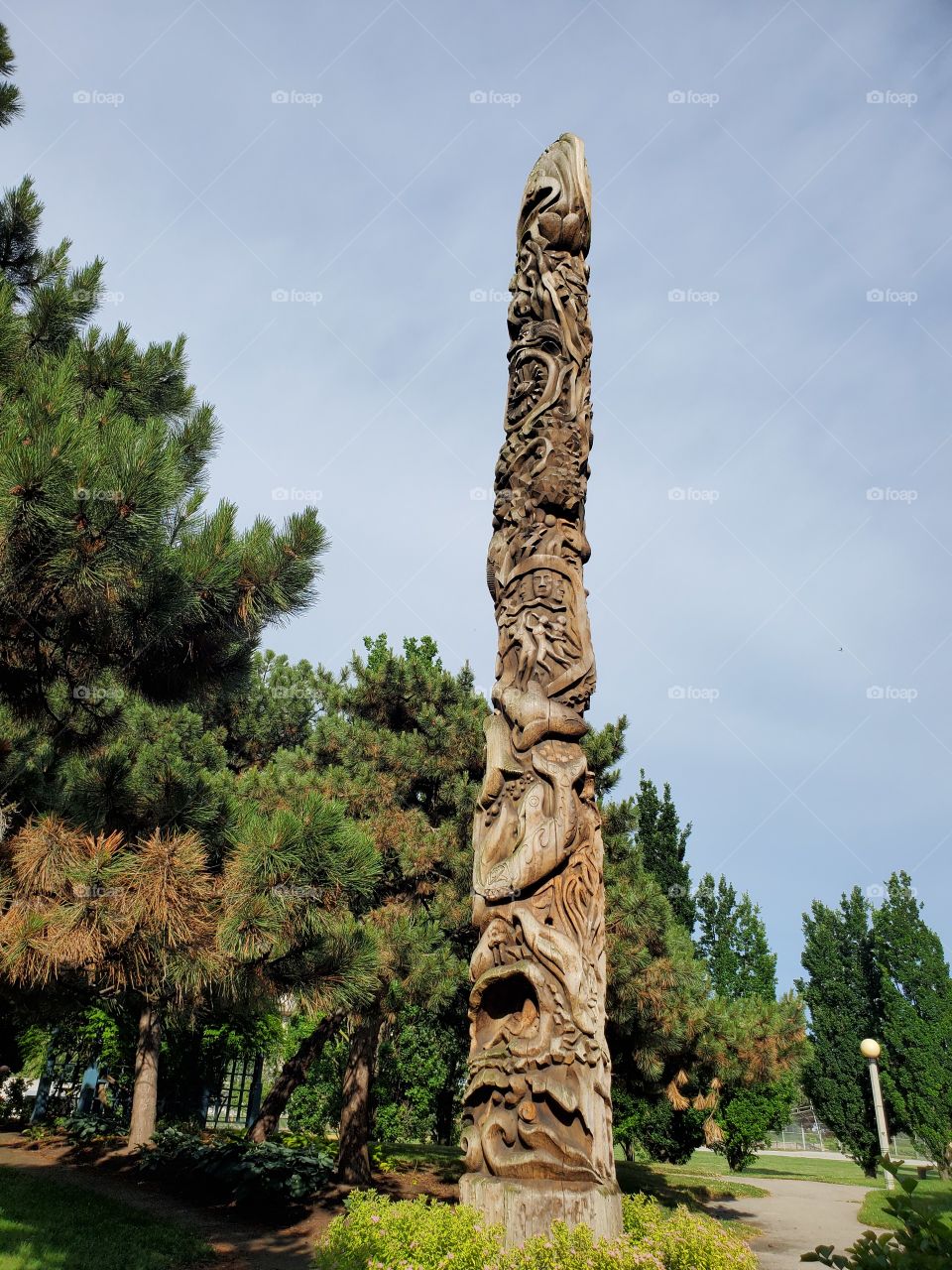 monument amidst lush trees in summer