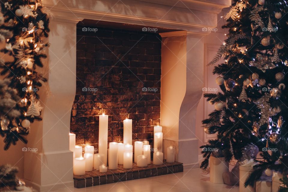 romantic light from candles by the fireplace