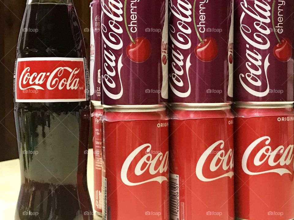 Coca Cola and cherry coke cans and bottle 