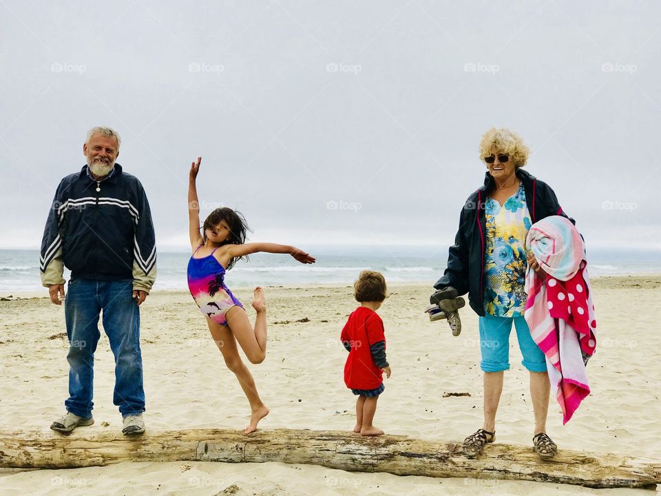 Awesome memories! on a log at the beach with the family.