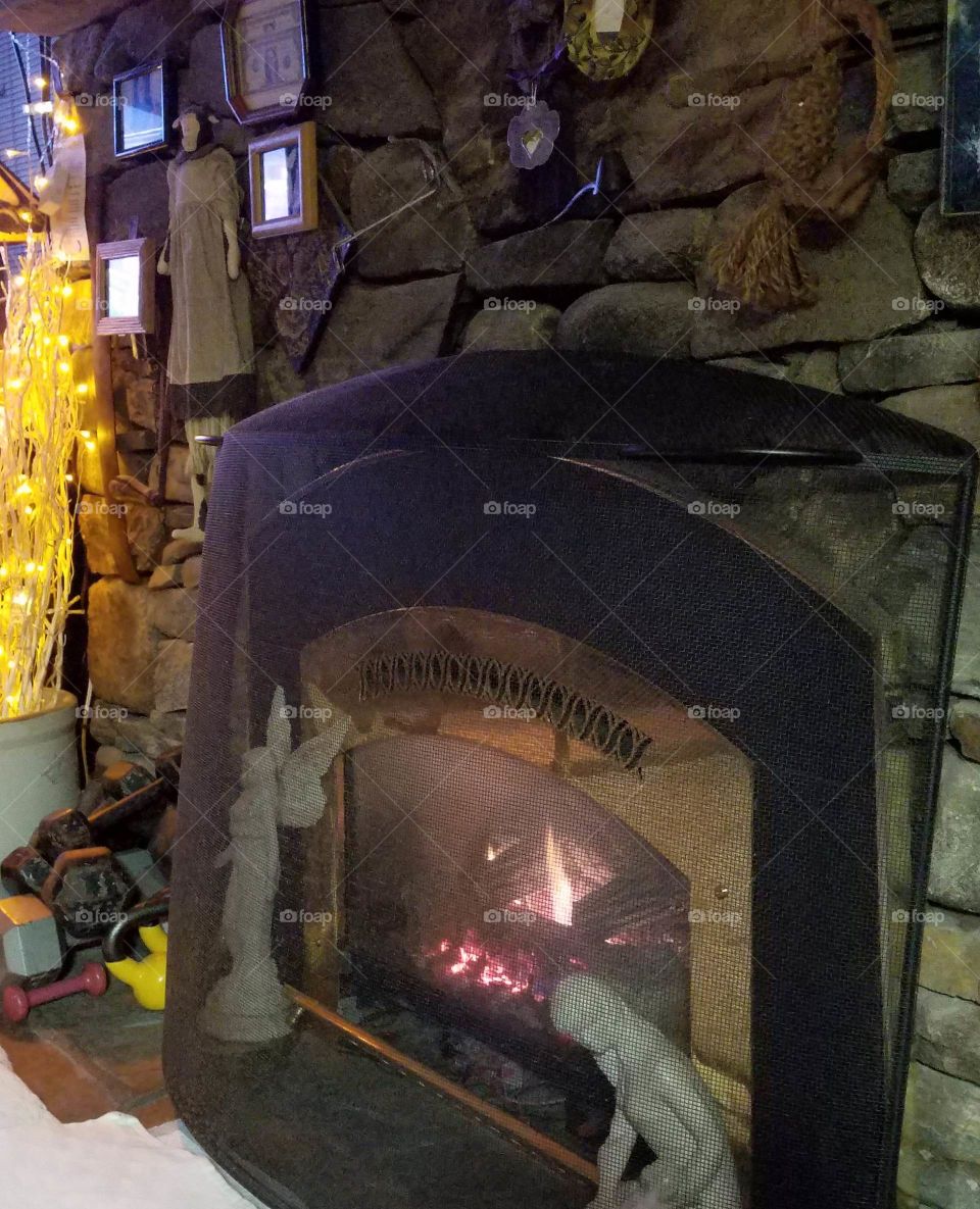 Gas log fireplace lit for warmth in cold New England🇺🇸 with LED lites adding atmosphere.