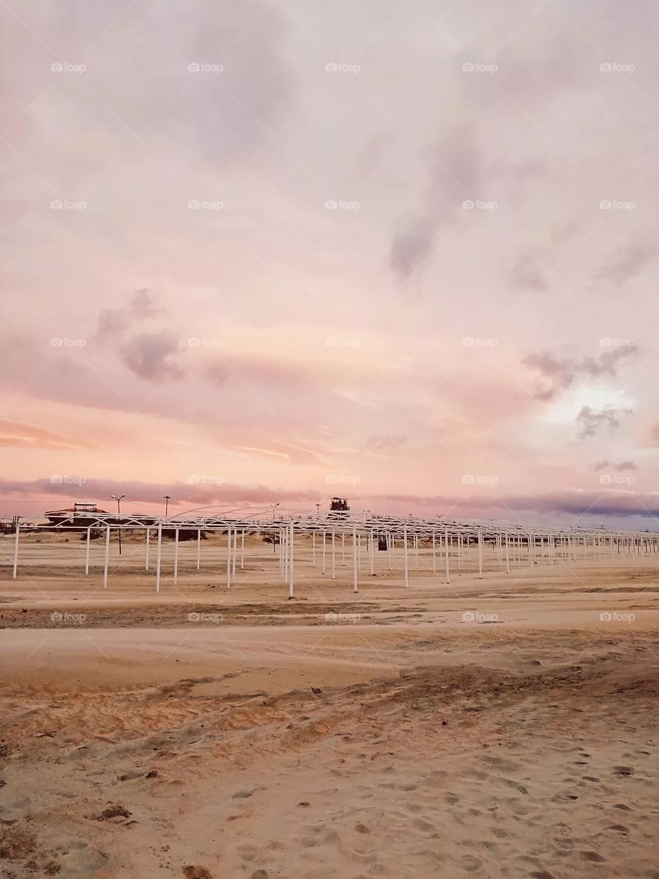 Pink vanilla sunset on the sand winter beach