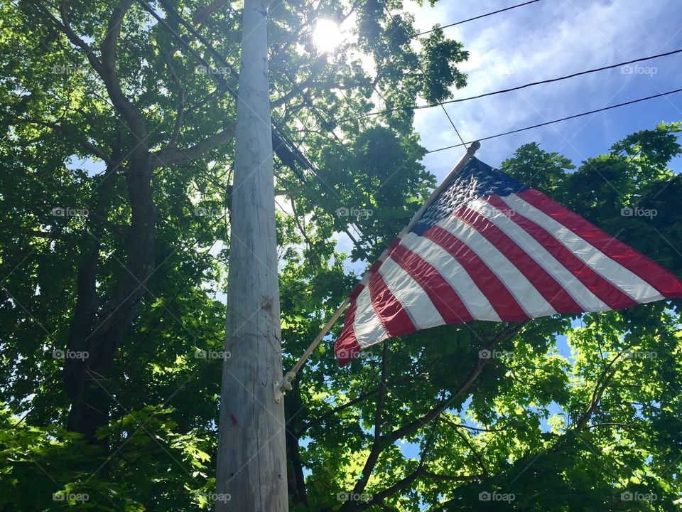 American flag on neighborhood light pole.