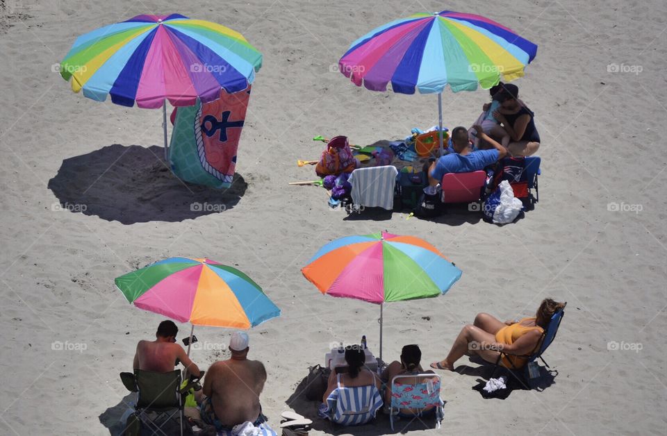 Colorful beach umbrellas in the sand. 