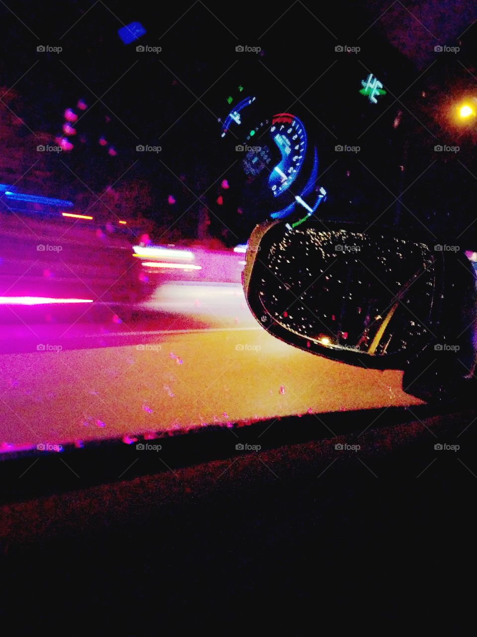 photographic distortion created from rain  reflecting police lights and motion blur