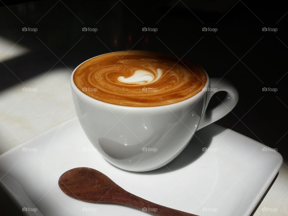 coffee art. latte art coffee in shadow