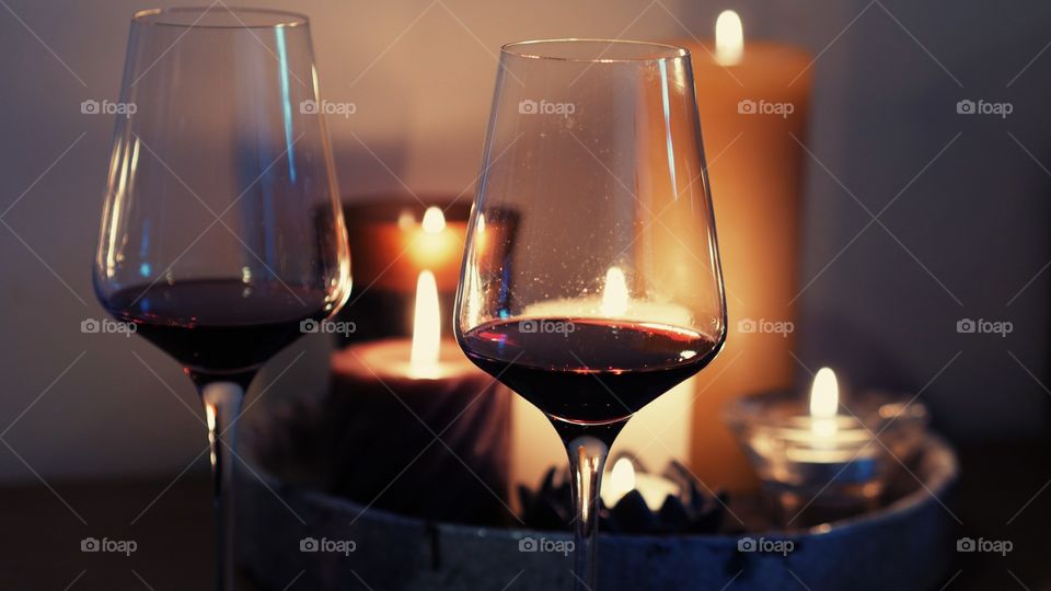 Romantic evening with wine and lit candles. This picture is perfect for valentines day, aniversaries, wineries, wine lovers or anyone who celebrates something or is celebrating life!
