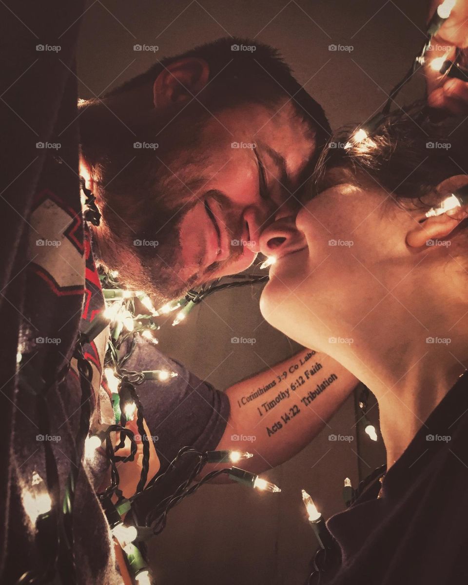 Wrapping ourselves up with tiny giggles and whispers under the Christmas lights 