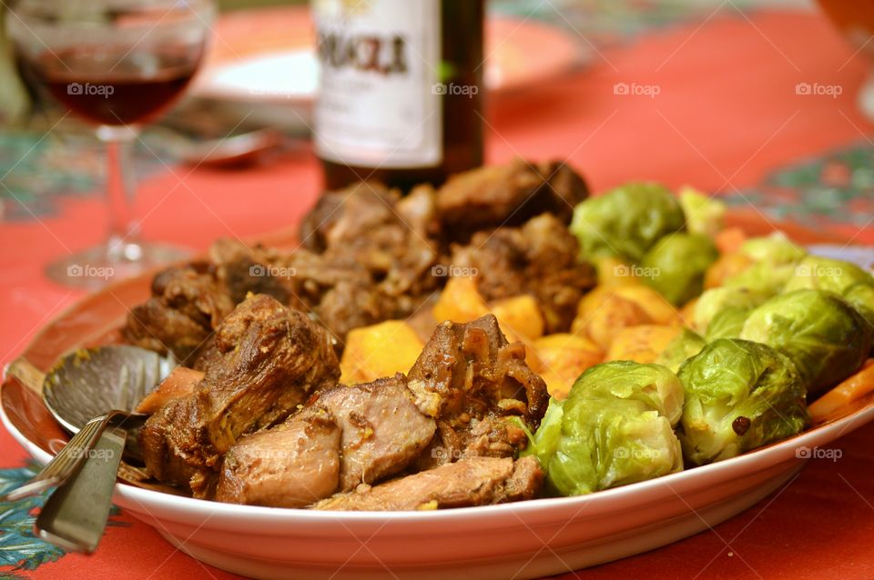 New Year's Eve dinner. Roast lamb with Brussels sprouts and potatoes.