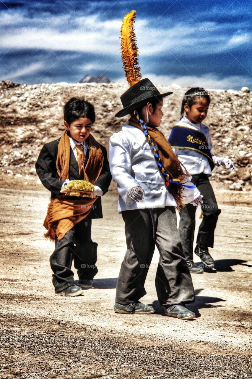 Children dancing in the desert at annual village fiesta, Atacama Desert, Chile . Children dancing in the desert at annual village fiesta, Atacama Desert, Chile 