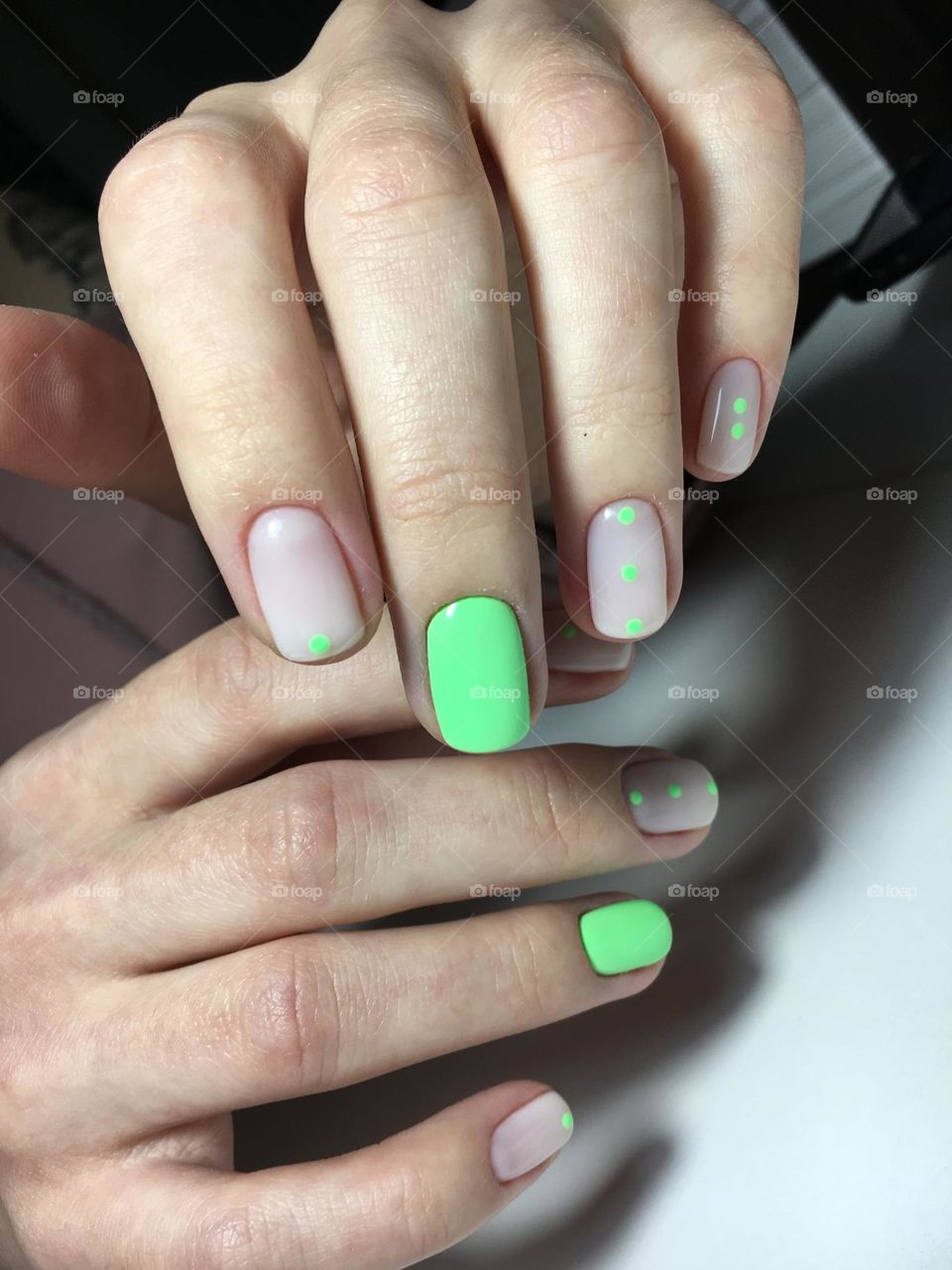 Painted nails, gel polish on nails, women's beautiful and neat manicure