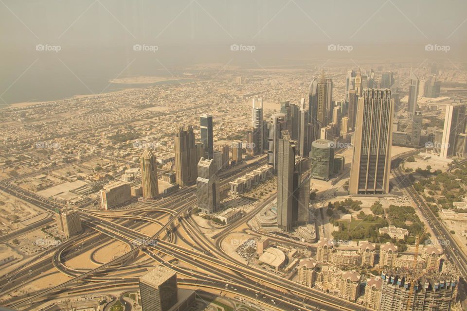 High-rise, modern buildings in Dubai and a large highway and interchange.