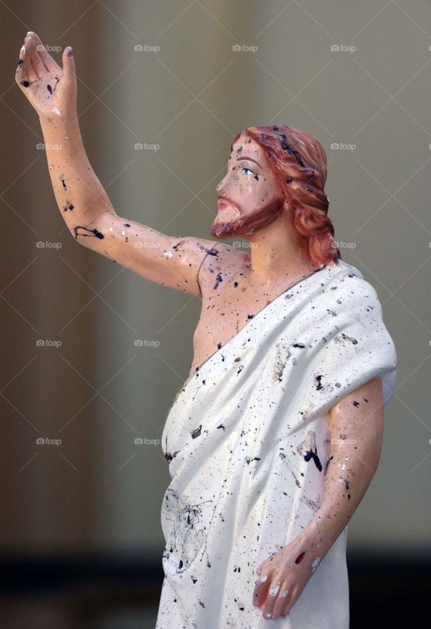 Blood stains are seen on a statue of Jesus Christ @Sri Lanka Terror Attack