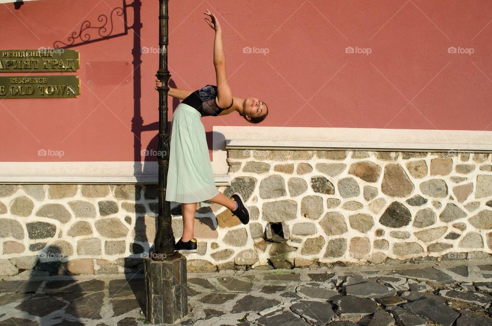 Young Female Ballerina Dancing Outside