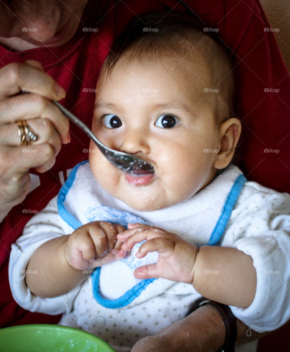 Feeding a cute baby